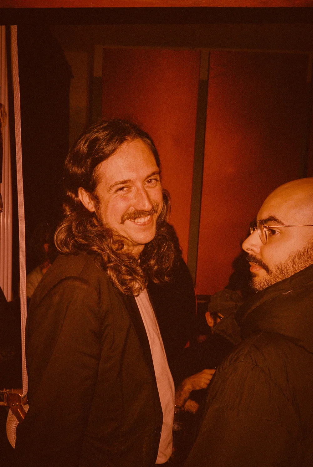 guests in warm orange light